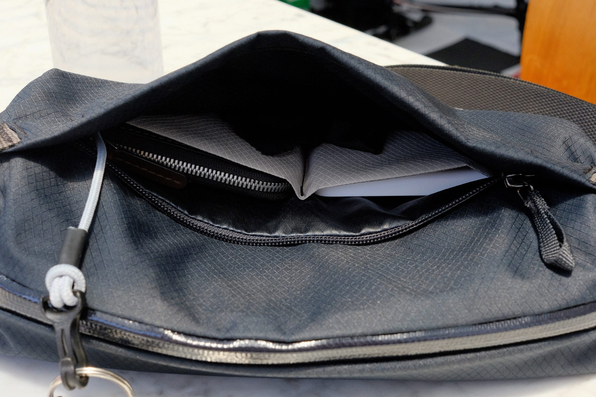Front pocket holding my Bellroy Card Pocket wallet (left) and Apple MagSafe Battery Pack (right)